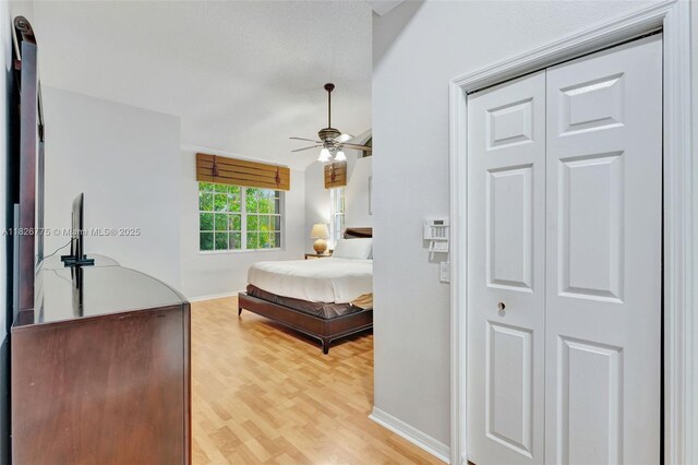 12442 NW 10th Ct Unit C-14, Coral Springs, FL 33071 - bedroom with light wood-type flooring, a skylight, ensuite bathroom, lofted ceiling, and ceiling fan