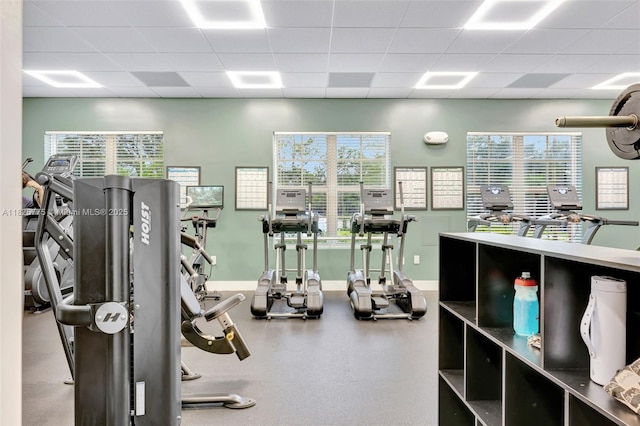 12442 NW 10th Ct Unit C-14, Coral Springs, FL 33071 - workout area featuring a drop ceiling and healthy amount of natural light