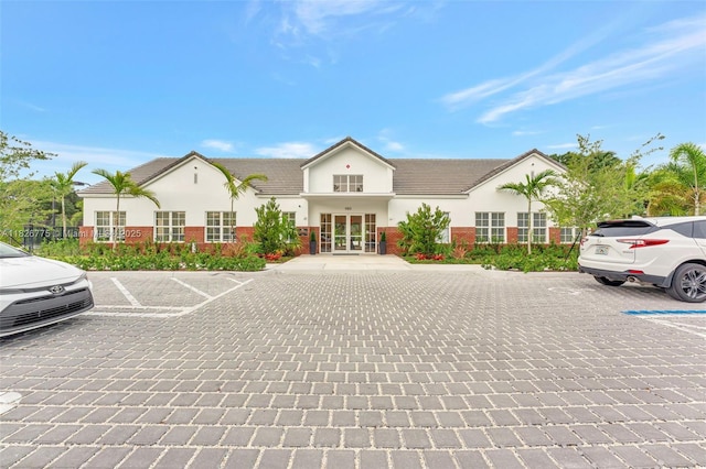 12442 NW 10th Ct Unit C-14, Coral Springs, FL 33071 - view of building exterior with uncovered parking
