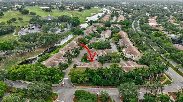 12442 NW 10th Ct Unit C-14, Coral Springs, FL 33071 - aerial perspective of suburban area with a nearby body of water and a golf course