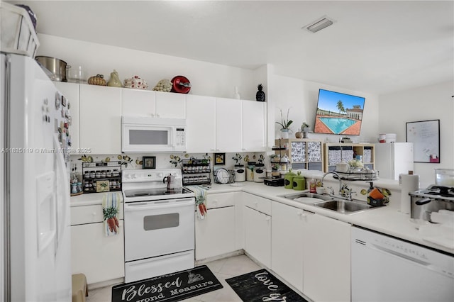 4292 SW 156th Ave Unit 154, Miramar, FL 33027 - kitchen with white appliances, white cabinetry, light countertops, and light tile patterned flooring