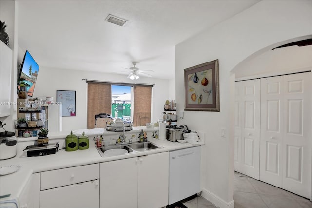 4292 SW 156th Ave Unit 154, Miramar, FL 33027 - kitchen with dishwasher, arched walkways, a ceiling fan, light tile patterned floors, and light countertops