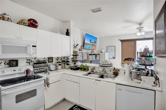 4292 SW 156th Ave Unit 154, Miramar, FL 33027 - kitchen with white appliances, light countertops, ceiling fan, and white cabinets