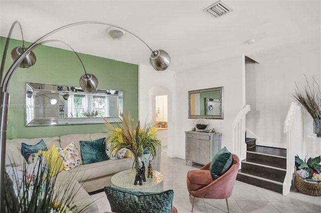 4292 SW 156th Ave Unit 154, Miramar, FL 33027 - tiled living room with arched walkways and stairway