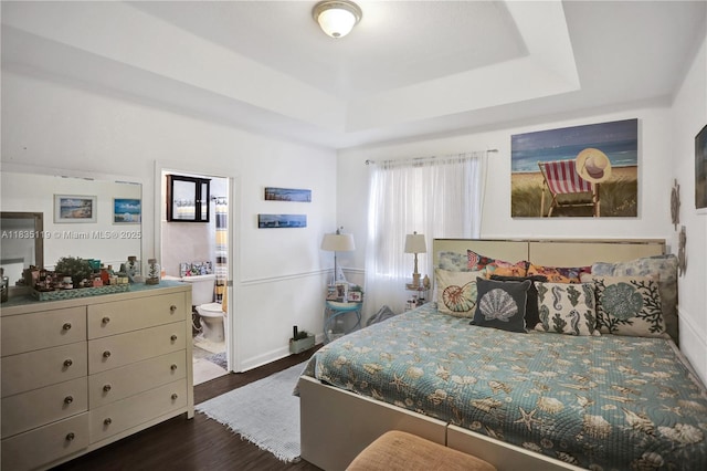 4292 SW 156th Ave Unit 154, Miramar, FL 33027 - bedroom with a tray ceiling, dark wood finished floors, and connected bathroom