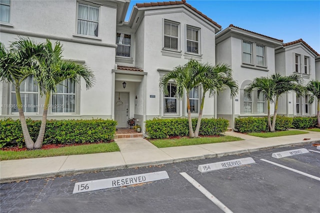4292 SW 156th Ave Unit 154, Miramar, FL 33027 - multi unit property featuring a tiled roof, stucco siding, and uncovered parking