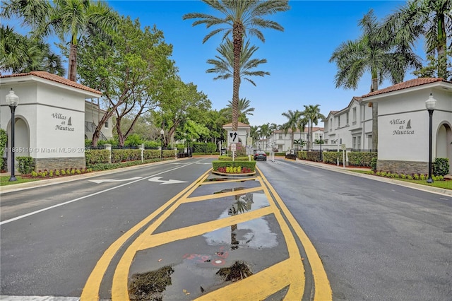 4292 SW 156th Ave Unit 154, Miramar, FL 33027 - view of asphalt road with street lights, a residential view, and curbs