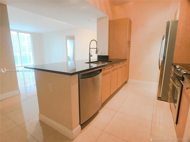 951 Brickell Ave Unit 2405, Miami, FL 33131 - kitchen featuring stainless steel appliances, a peninsula, light tile patterned floors, and dark countertops