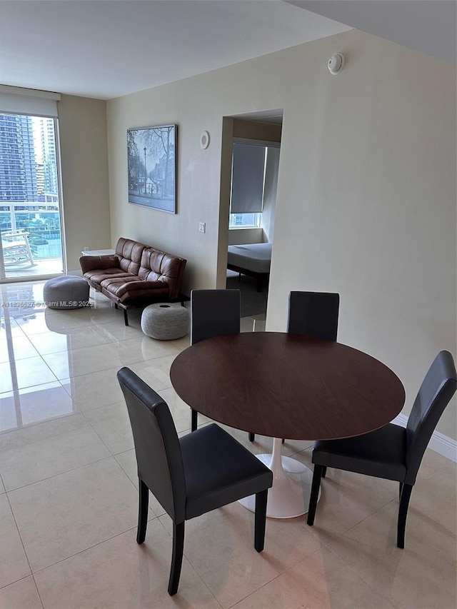 951 Brickell Ave Unit 2405, Miami, FL 33131 - dining space with light tile patterned floors