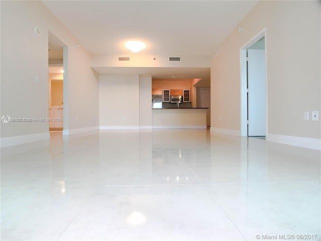 951 Brickell Ave Unit 2405, Miami, FL 33131 - spare room with light tile patterned flooring and baseboards