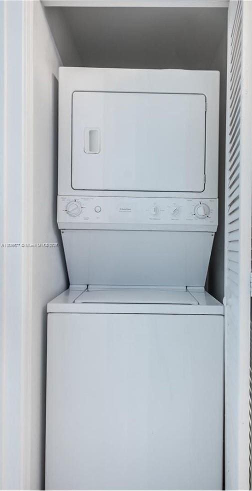 951 Brickell Ave Unit 2405, Miami, FL 33131 - laundry area with stacked washing machine and dryer