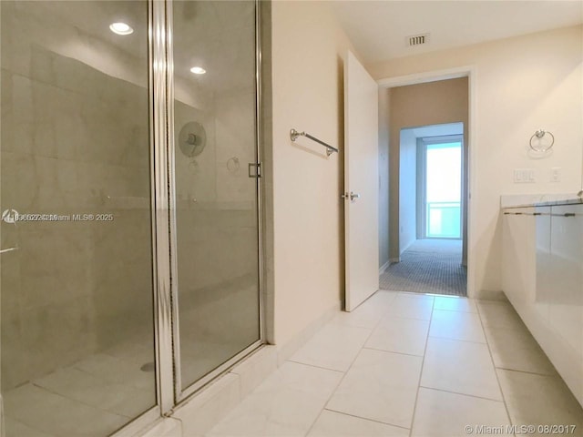 951 Brickell Ave Unit 2405, Miami, FL 33131 - full bathroom featuring a shower stall, vanity, and tile patterned flooring