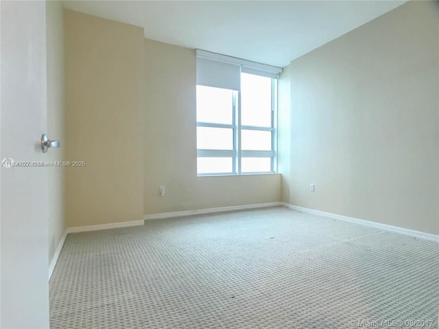 951 Brickell Ave Unit 2405, Miami, FL 33131 - empty room featuring carpet flooring and baseboards