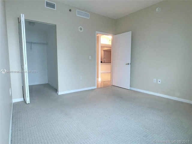 951 Brickell Ave Unit 2405, Miami, FL 33131 - unfurnished bedroom with carpet and a closet