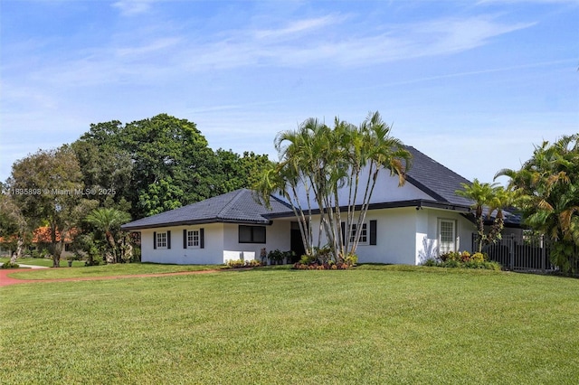 11965 SW 15th Ct, Davie, FL 33325 - ranch-style house featuring stucco siding and a front lawn