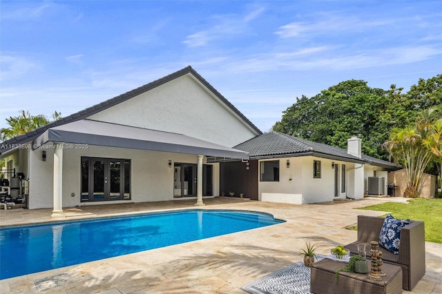 11965 SW 15th Ct, Davie, FL 33325 - outdoor pool with french doors and a patio area