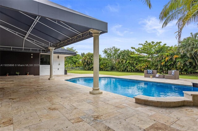 11965 SW 15th Ct, Davie, FL 33325 - swimming pool featuring a patio area