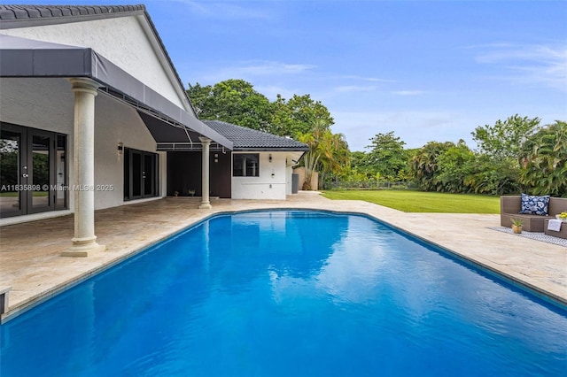 11965 SW 15th Ct, Davie, FL 33325 - swimming pool with a patio area, french doors, and a yard