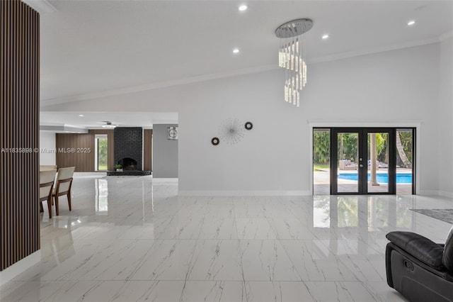 11965 SW 15th Ct, Davie, FL 33325 - living area featuring marble look tile flooring, ornamental molding, french doors, recessed lighting, and a chandelier