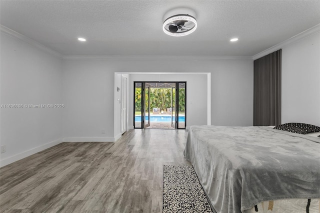 11965 SW 15th Ct, Davie, FL 33325 - bedroom with access to outside, wood finished floors, ornamental molding, a textured ceiling, and recessed lighting