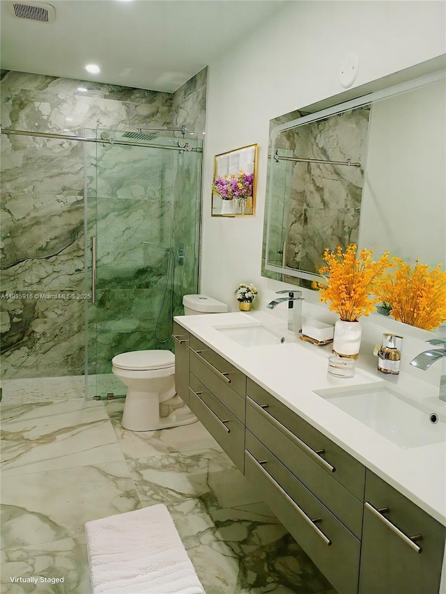 6128 N Kings Gate Cir, Delray Beach, FL 33484 - bathroom with double vanity, a marble finish shower, and marble finish flooring