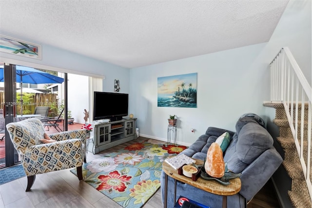 3300 Atlanta St, Hollywood, FL 33021 - living room featuring a textured ceiling, stairs, and french doors