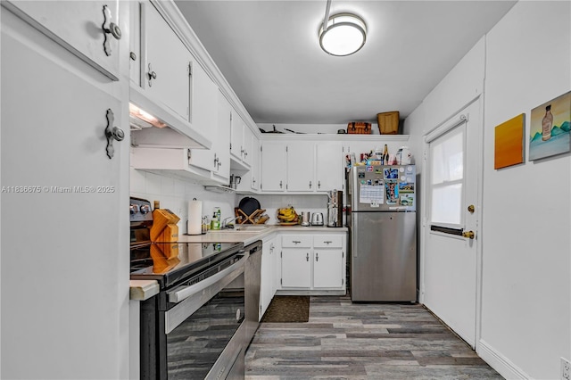 3401 N Country Club Dr Unit 308, Aventura, FL 33180 - kitchen featuring stainless steel appliances, wood finished floors, white cabinets, and light countertops