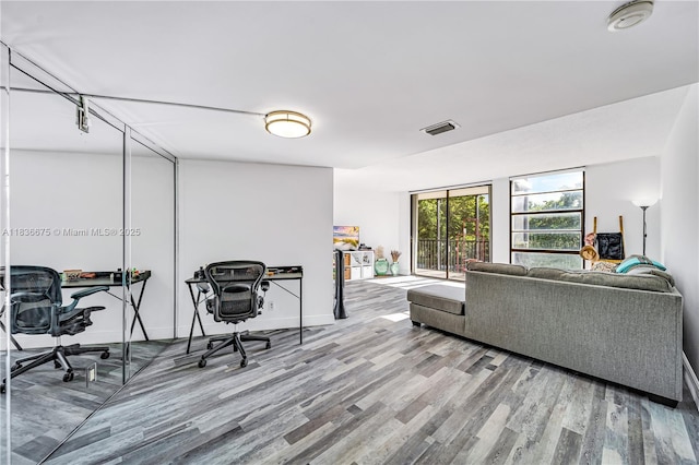 3401 N Country Club Dr Unit 308, Aventura, FL 33180 - living room featuring wood finished floors and an office area