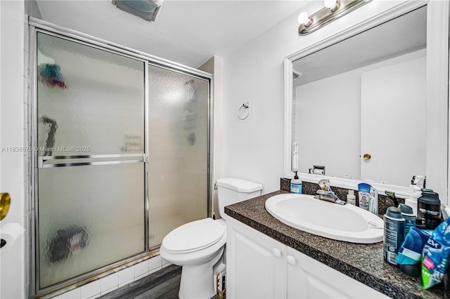 3401 N Country Club Dr Unit 308, Aventura, FL 33180 - bathroom featuring vanity, a shower stall, and wood finished floors
