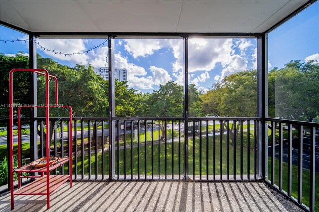 3401 N Country Club Dr Unit 308, Aventura, FL 33180 - unfurnished sunroom with view of scattered trees