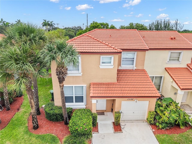 15107 NW 8th St, Pembroke Pines, FL 33028 - view of front of property with a tiled roof, stucco siding, concrete driveway, and a garage
