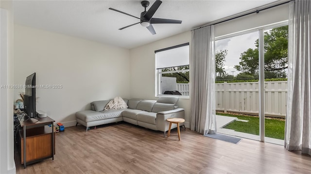 15107 NW 8th St, Pembroke Pines, FL 33028 - living area featuring a ceiling fan and light wood-style floors