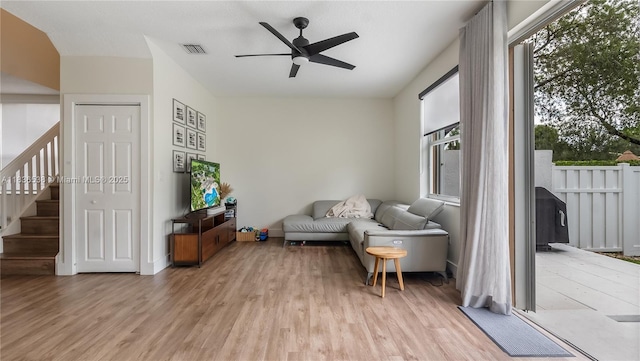 15107 NW 8th St, Pembroke Pines, FL 33028 - living area featuring a ceiling fan, light wood-style floors, and stairway