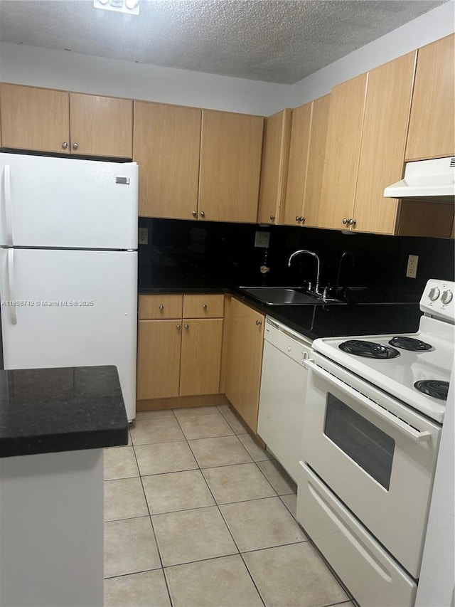 7110 NW 179th St Unit 110, Hialeah, FL 33015 - kitchen with white appliances, under cabinet range hood, light tile patterned floors, and light brown cabinets
