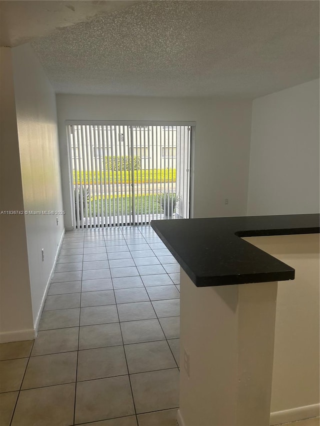 7110 NW 179th St Unit 110, Hialeah, FL 33015 - unfurnished room with light tile patterned floors and a textured ceiling