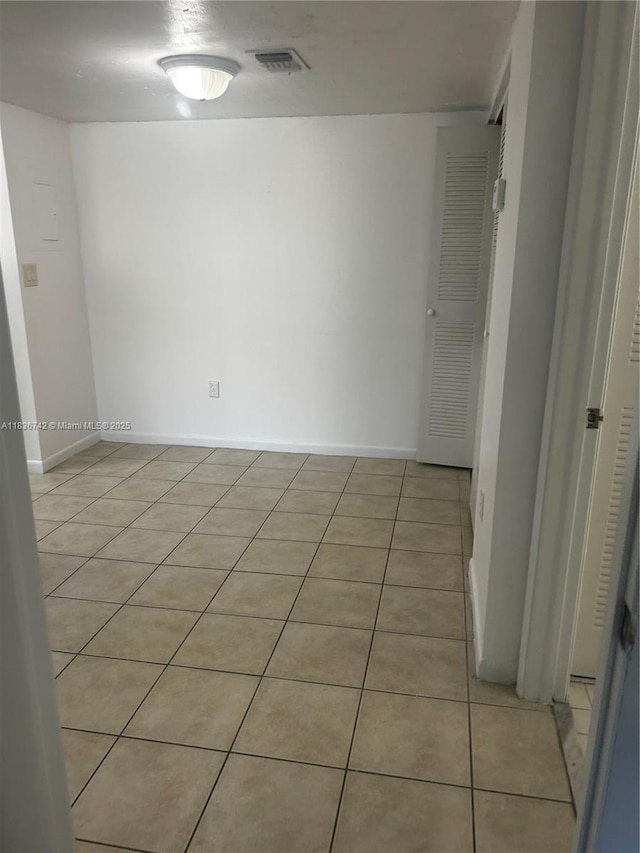 7110 NW 179th St Unit 110, Hialeah, FL 33015 - empty room with light tile patterned flooring and baseboards