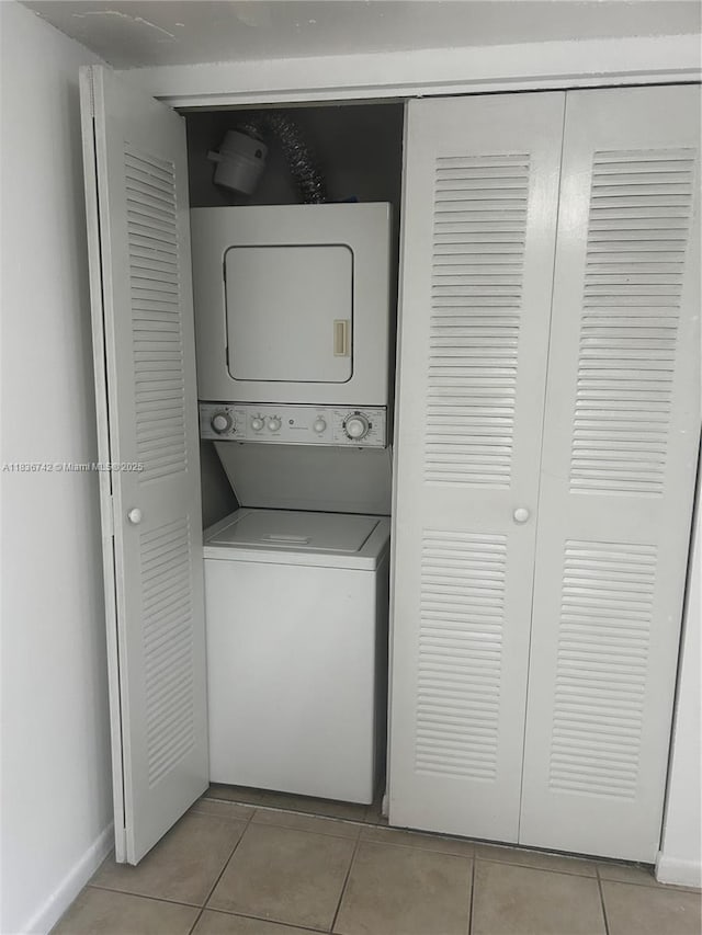 7110 NW 179th St Unit 110, Hialeah, FL 33015 - washroom featuring estacked washer and dryer and light tile patterned floors