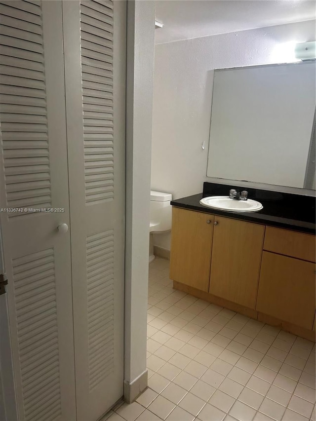 7110 NW 179th St Unit 110, Hialeah, FL 33015 - bathroom featuring a closet, vanity, and tile patterned flooring