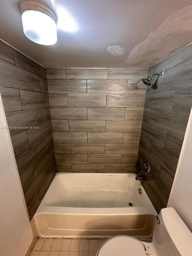 7110 NW 179th St Unit 110, Hialeah, FL 33015 - bathroom featuring washtub / shower combination, tile patterned floors, and a textured ceiling