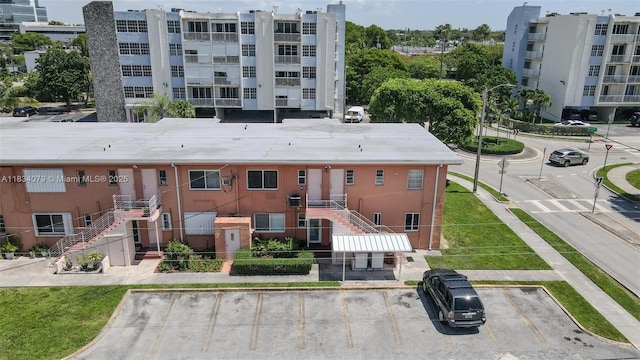 3600 SW 9th Ter Unit 1B, Miami, FL 33135 - view of apartment building / complex featuring uncovered parking and stairs