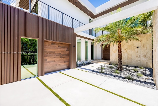 1351 SW 16th St, Miami, FL 33145 - property entrance featuring an attached garage and driveway