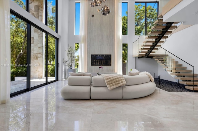 1351 SW 16th St, Miami, FL 33145 - living room featuring a towering ceiling and stairway