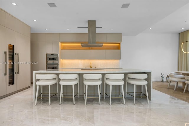 1351 SW 16th St, Miami, FL 33145 - kitchen with double oven, light marble finish floors, modern cabinets, light countertops, and recessed lighting