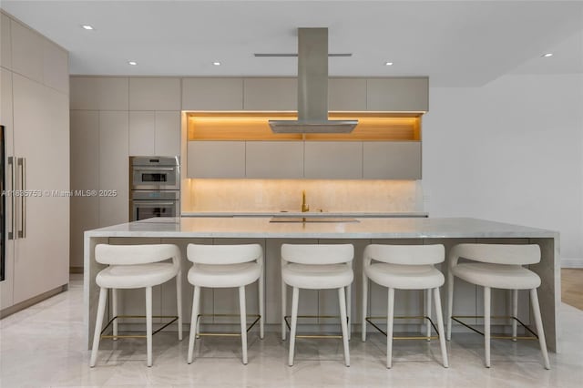 1351 SW 16th St, Miami, FL 33145 - kitchen with double oven, modern cabinets, gray cabinets, backsplash, and a spacious island