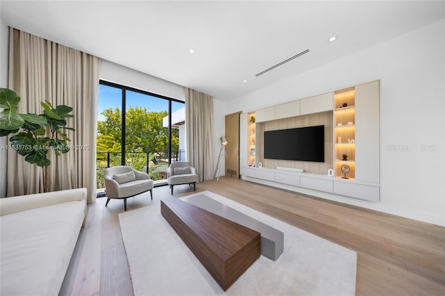 1351 SW 16th St, Miami, FL 33145 - living area with light wood-style flooring and recessed lighting