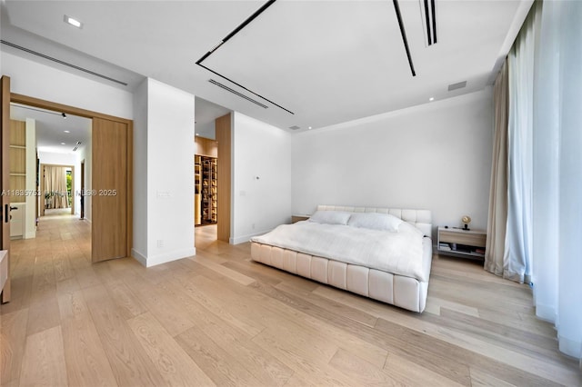 1351 SW 16th St, Miami, FL 33145 - bedroom with light wood-style floors and baseboards