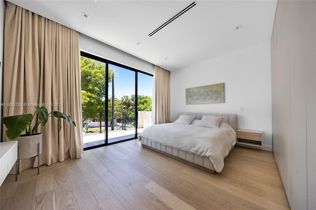 1351 SW 16th St, Miami, FL 33145 - bedroom featuring access to outside and light wood-type flooring