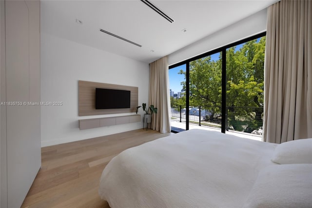 1351 SW 16th St, Miami, FL 33145 - bedroom featuring access to exterior and wood finished floors