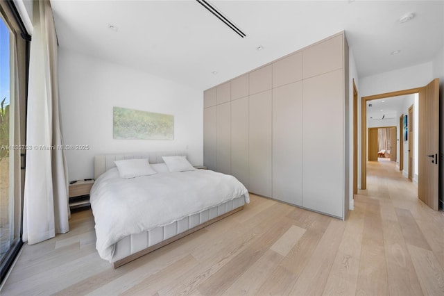 1351 SW 16th St, Miami, FL 33145 - bedroom with light wood finished floors and a closet