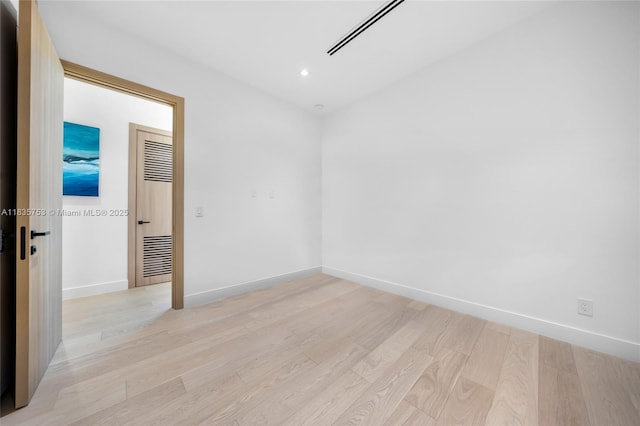 1351 SW 16th St, Miami, FL 33145 - empty room featuring light wood-type flooring and recessed lighting